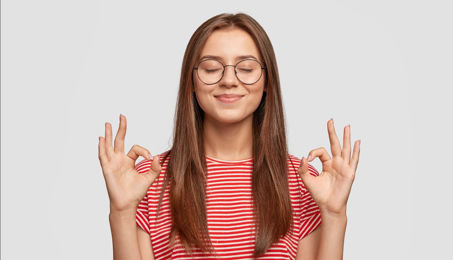 Pleased Satisfied Young Female Model Makes Zero Gesture Wears Transparent Glasses Has Long Dark Hair